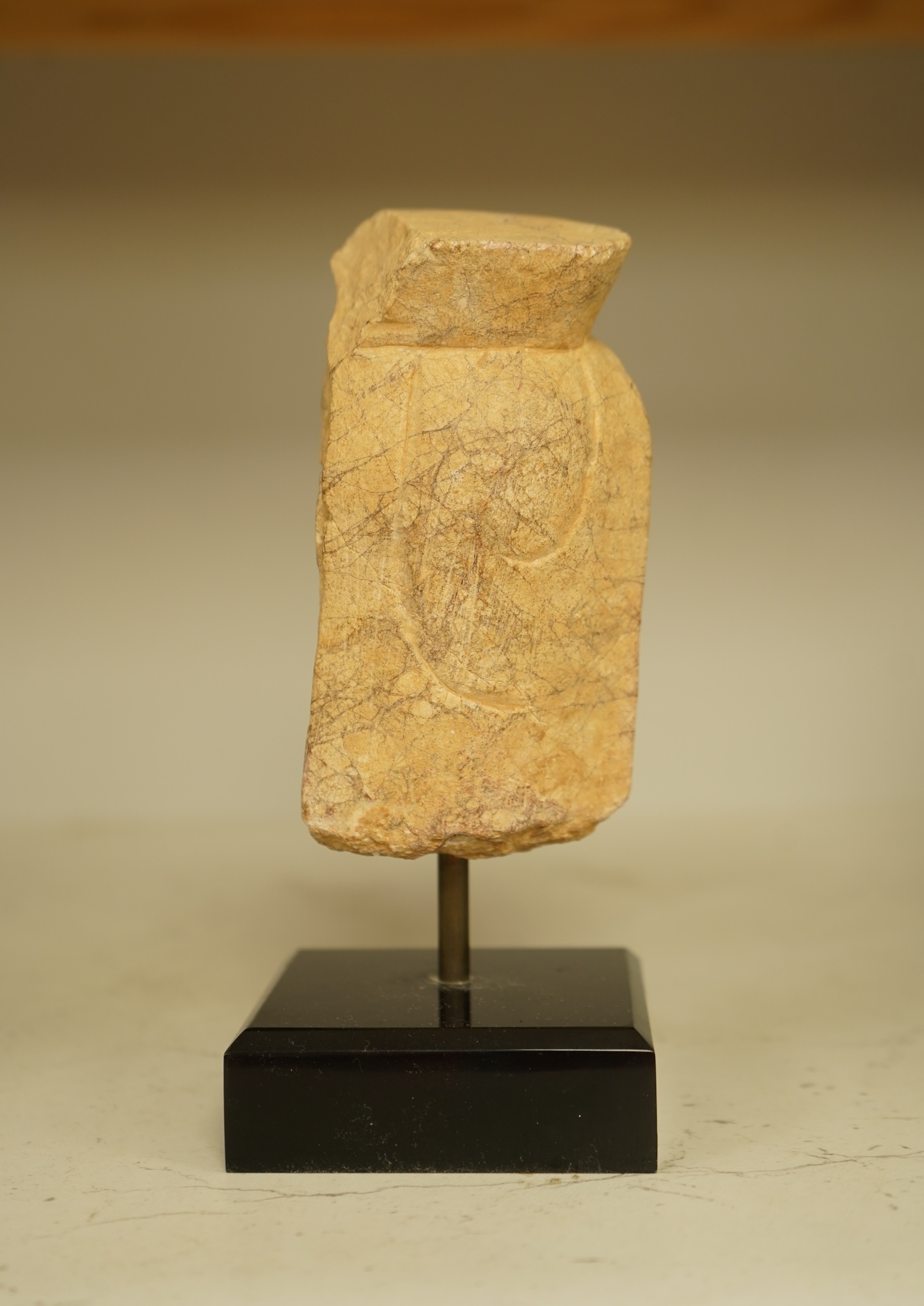 A composition bust of Bodhisattva, possibly Tibetan, on stand, 18cm high